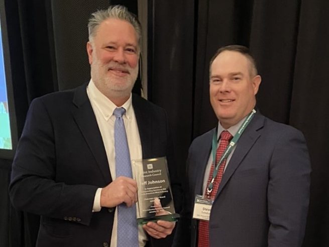 Jeff johnson accepts award at 2025 Mint Industry Research Council Meeting
