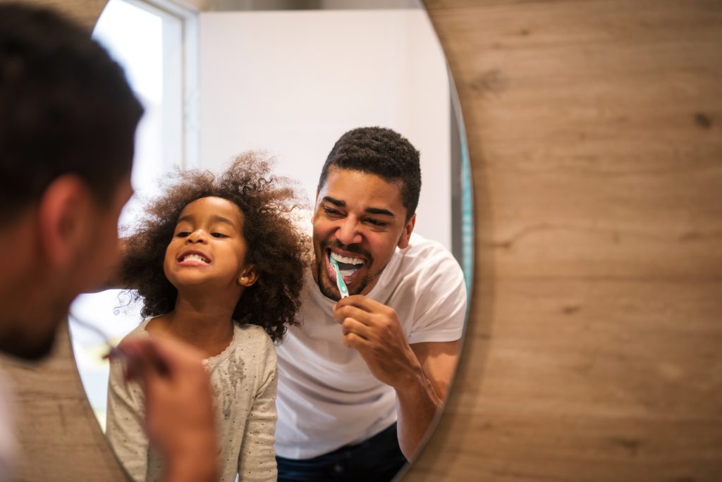family enjoying brushing their teeth 